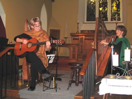 Janine on guitar, Susan on harp at winter 2008 concert